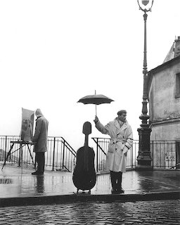 Celist with Umbrella in Rain