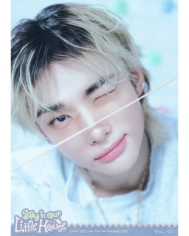 Hyunjin from Stray Kids close-up portrait with blonde hair and soft smile