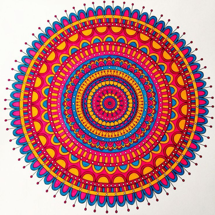 Vibrant circular mandala with colorful concentric geometric patterns in red, blue, yellow, and pink