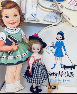 Vintage Betsy McCall dolls with paper doll cutout and carrying case from the 1950s