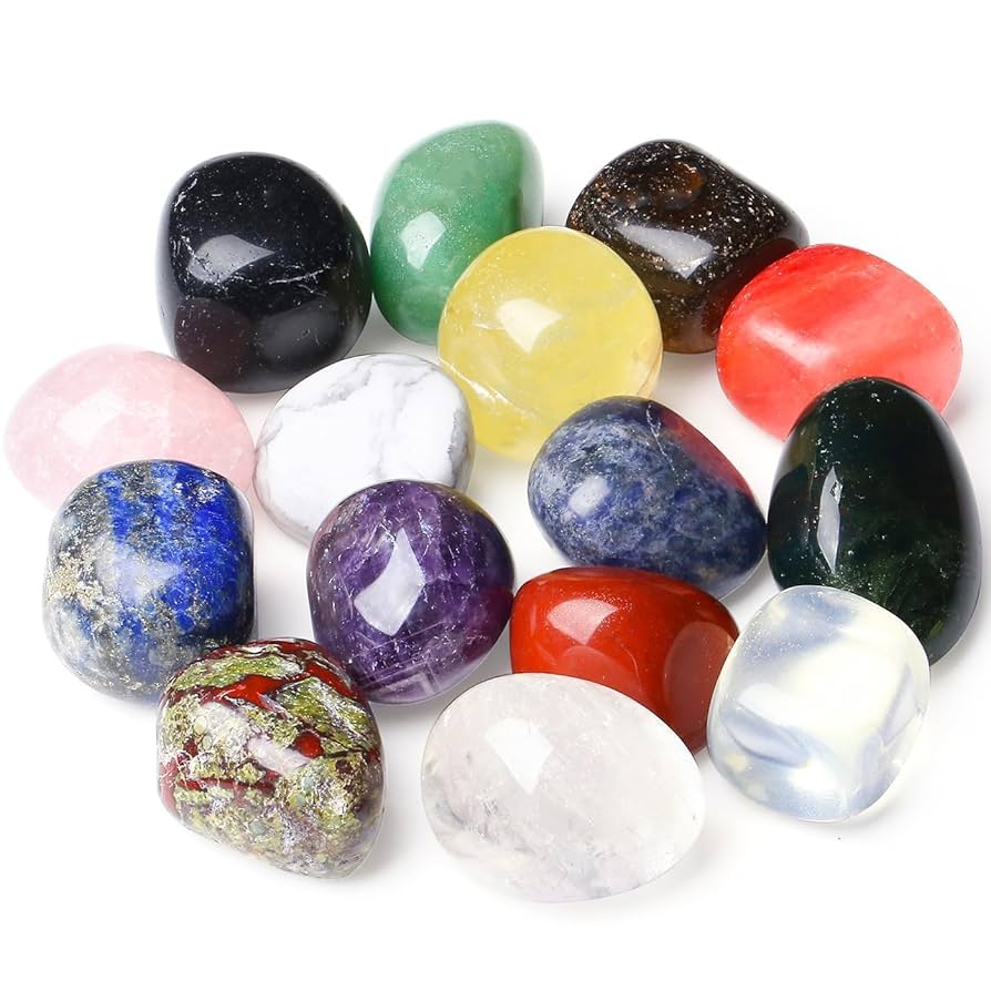 Colorful polished gemstones and mineral stones on a white background