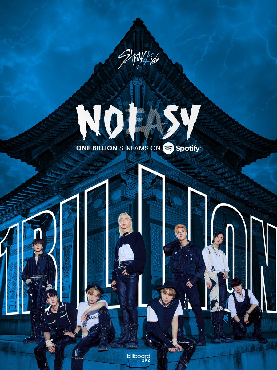 K-pop group Stray Kids posing together in front of a Korean palace with blue lighting and large text overlay