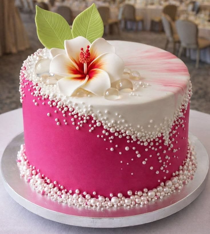 Frosted layer cake with cream swirls and colorful decorations on a plate