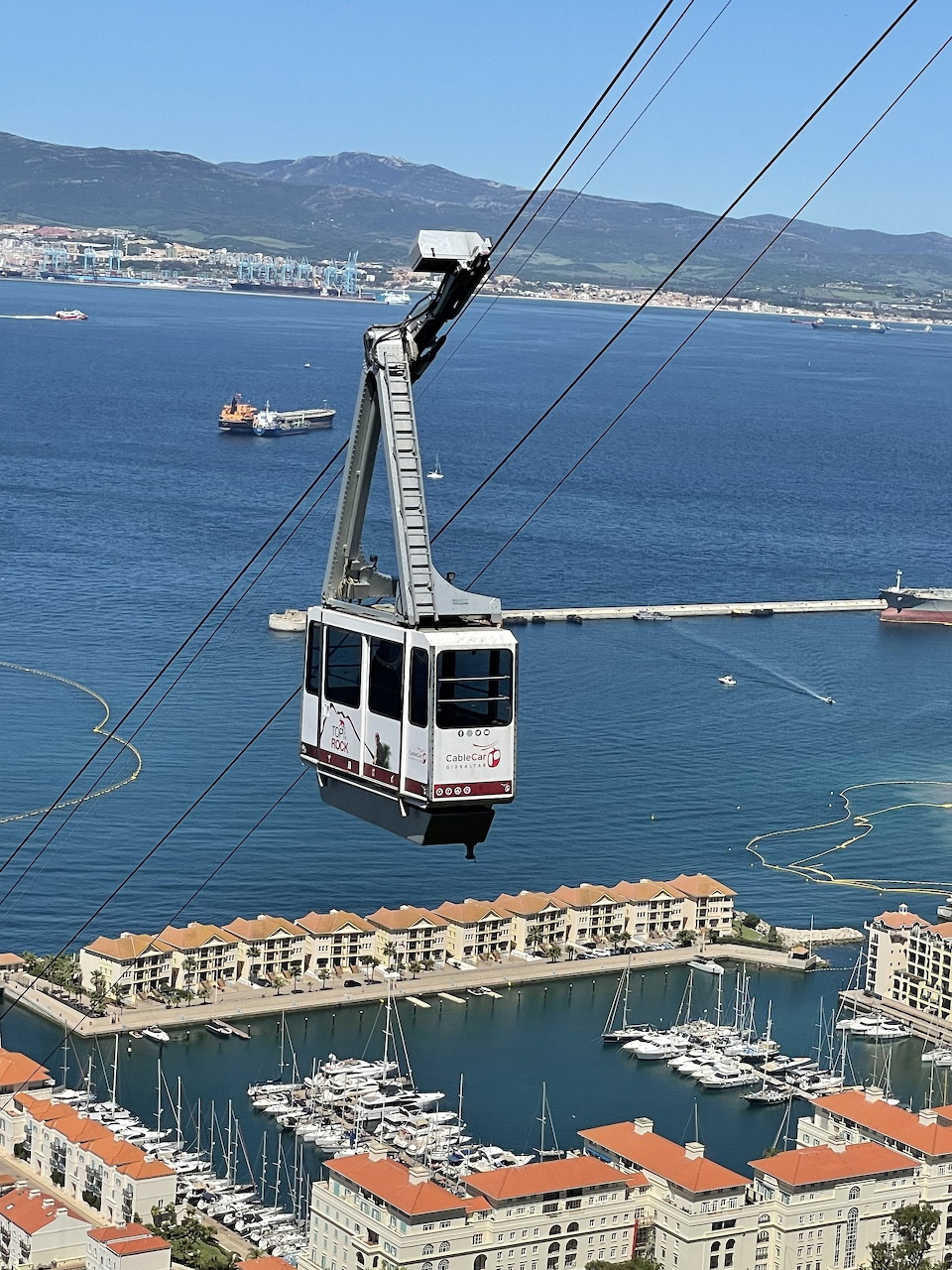 Cable car ascending the Rock of Gibraltar with bay views below