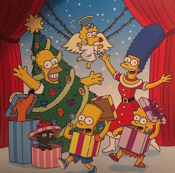 Simpsons family Christmas celebration with tree, angel, and presents on stage