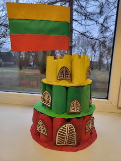 Handcrafted model of Gediminas Castle made from cardboard tubes with Lithuanian flag on top