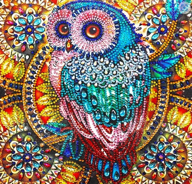 Colorful mosaic owl with mandala patterns and beaded texture on ornate floral background