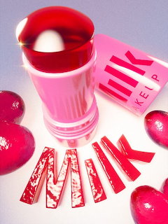 Milk Makeup blush stick with pink packaging, red hearts, and brand name spelled out in red letters