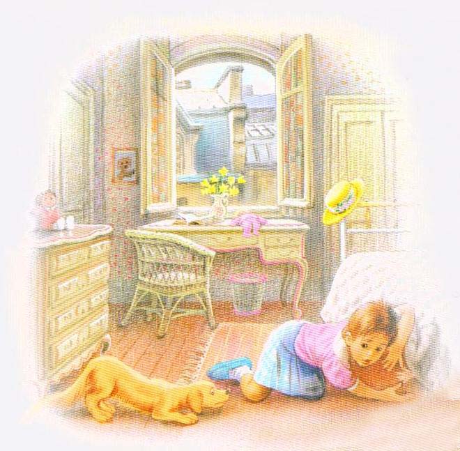 Child in blue lying on floor playing with orange cat in sunlit room with ocean view window