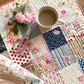 Coffee on Patchwork Quilt