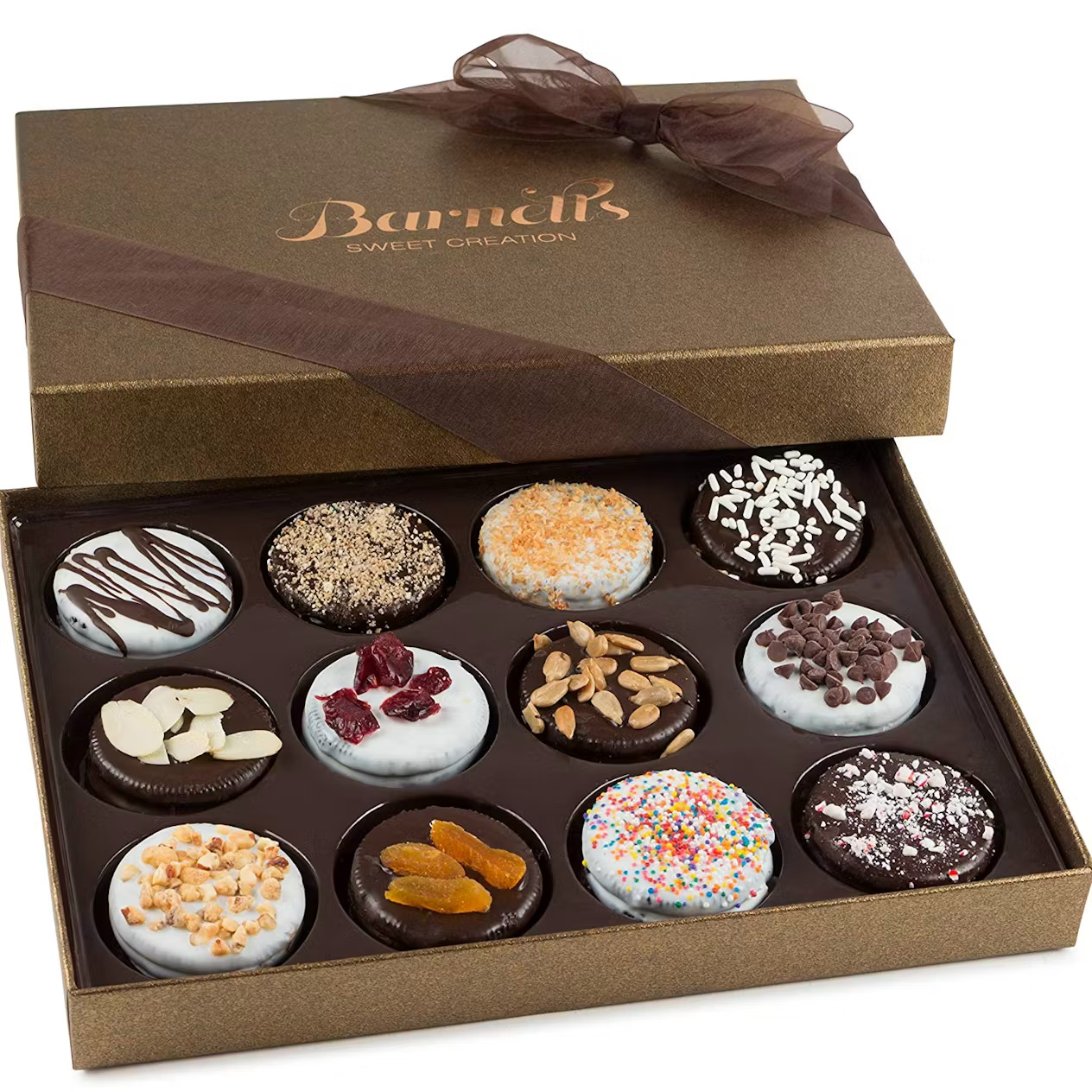 Gold gift box containing twelve decorated chocolate-covered cookies with assorted toppings