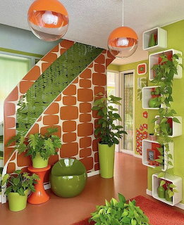 Orange tiled staircase with green carpet and lime walls in modern interior with hanging plants