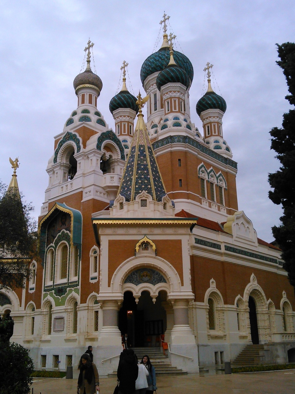 Russian Orthodox church with golden onion domes and white walls