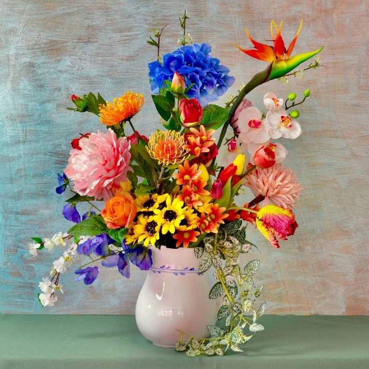 Assorted flowers white vase