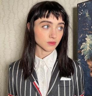 Woman in Striped Blazer
