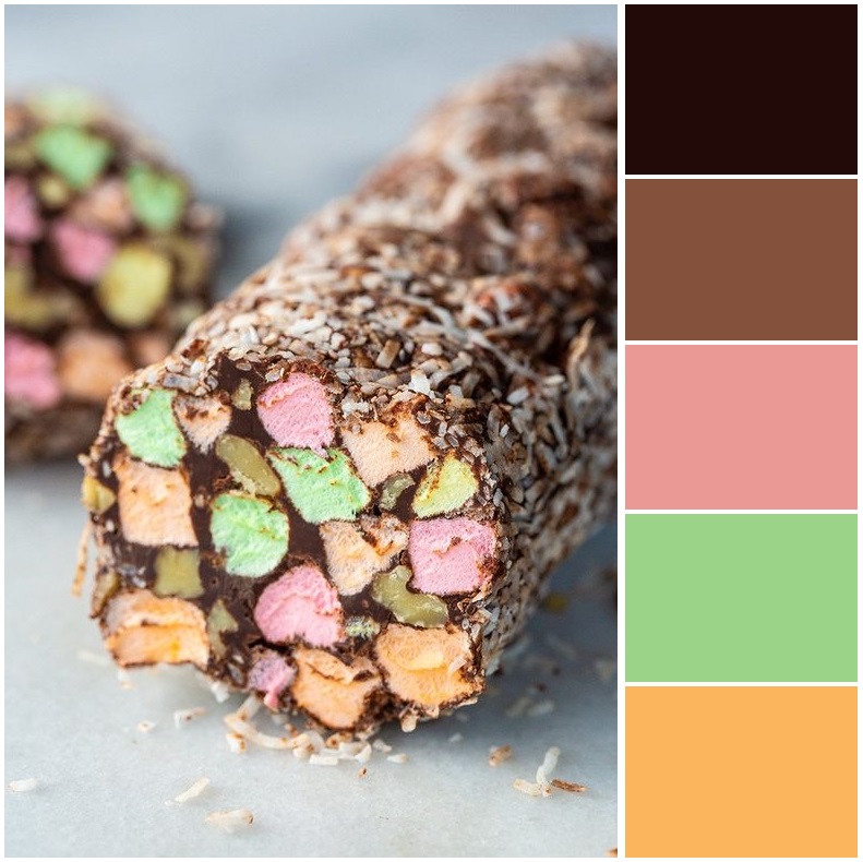 Sliced chocolate roll with colorful marshmallow mosaic pattern inside