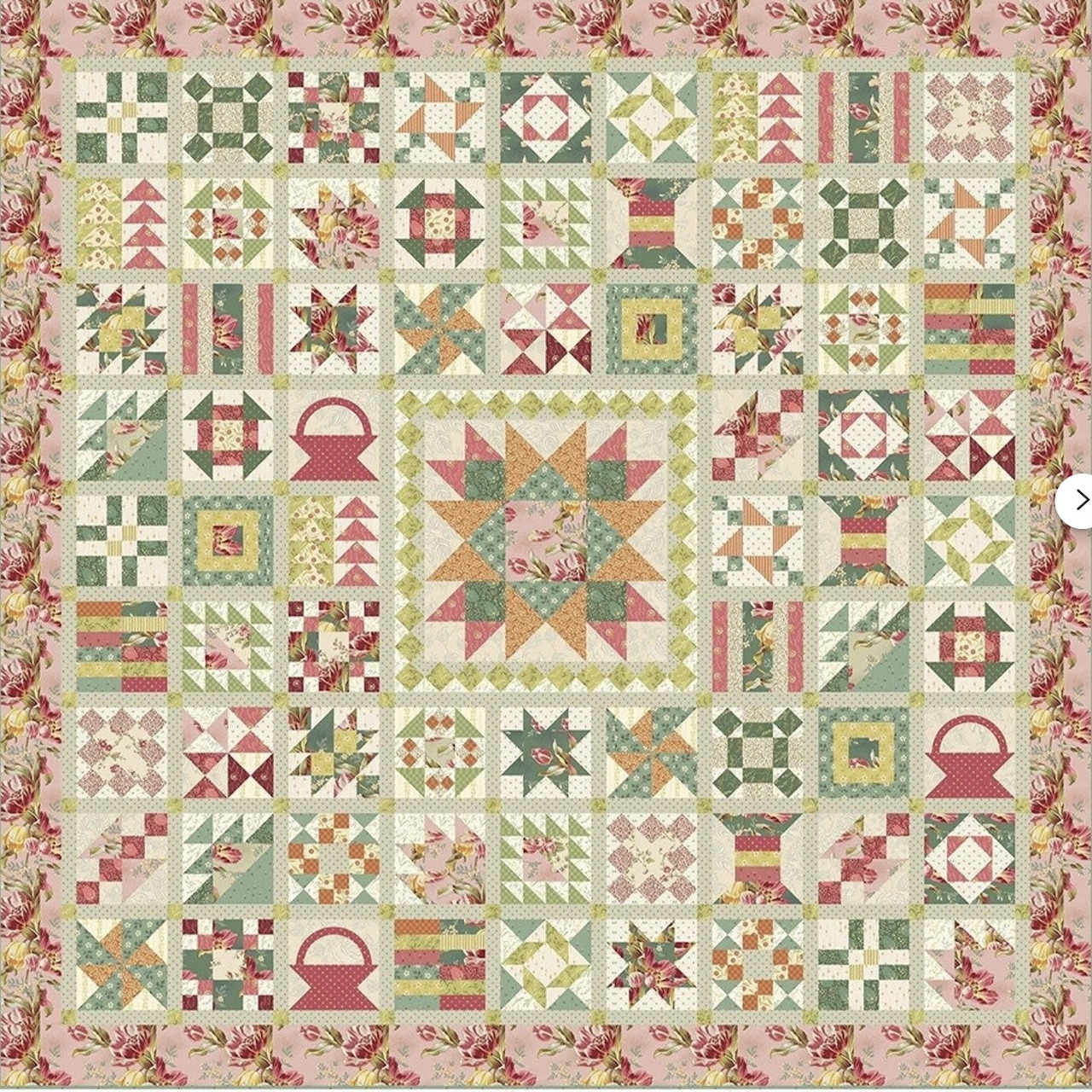 Vintage sampler quilt with various traditional patchwork blocks and floral border in pastel colors