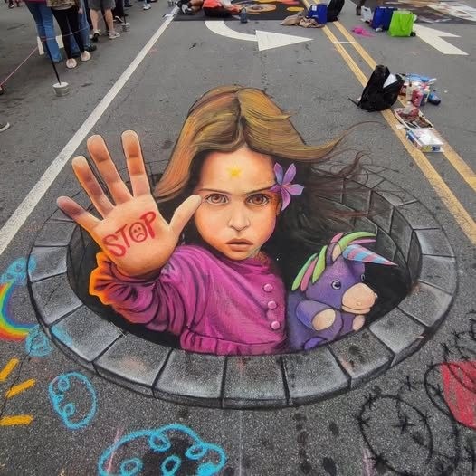 3D street chalk art of a girl in a manhole raising her hand with stop written on her palm