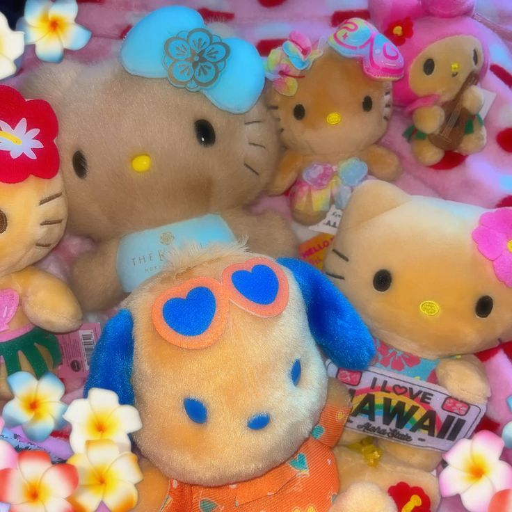 Close-up of several Hello Kitty plush toys in pastel colors with flowers and heart-shaped sunglasses
