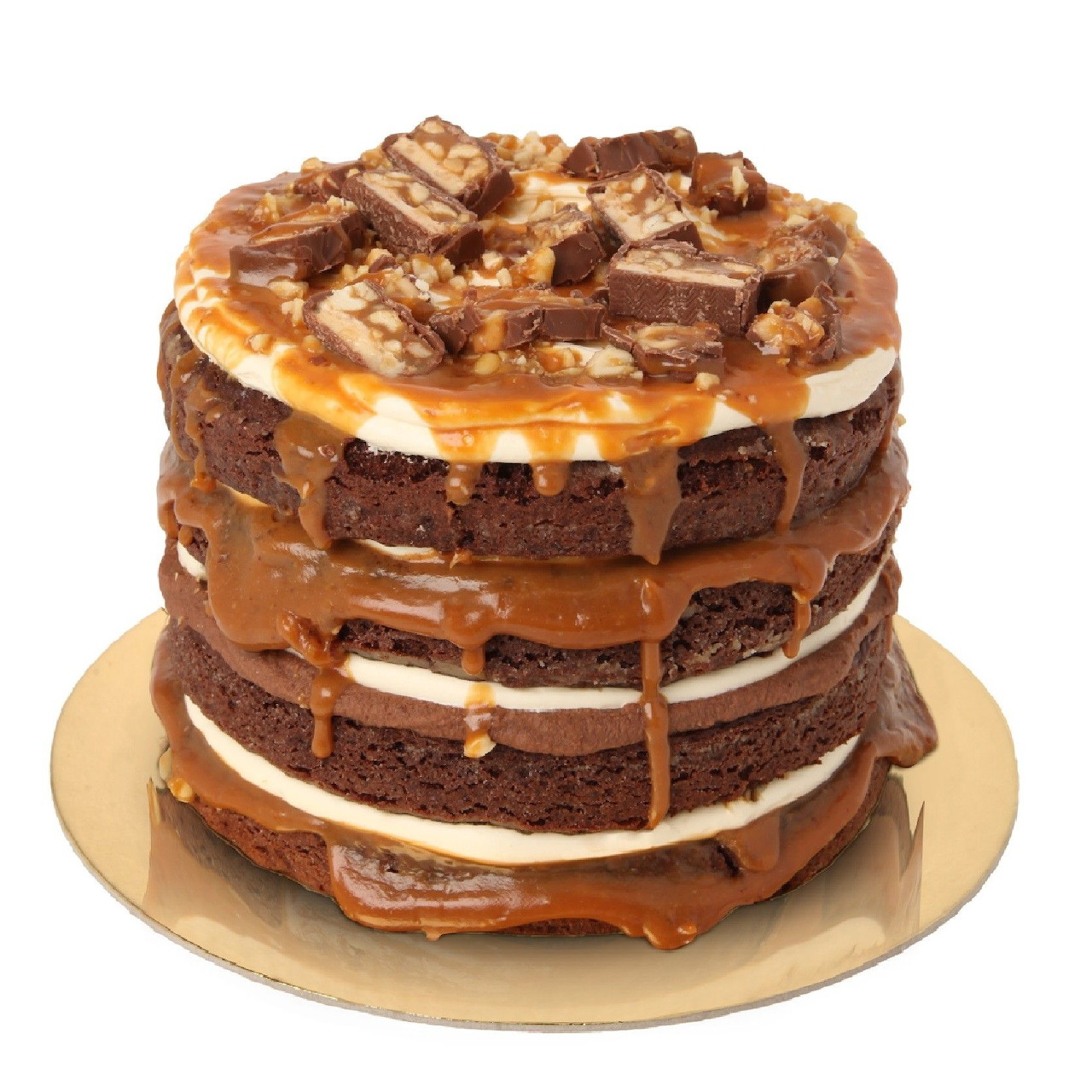 Four-layer chocolate cake with caramel drip, white cream filling, and candy pieces on top