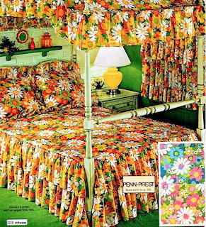 1970s bedroom with bold orange floral beding, curtains, green shag carpet and yellow lamp from vintage catalog