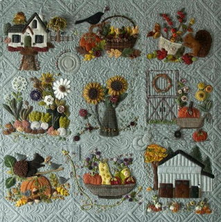 Patchwork quilt with farm animals and barn squares in colorful fabric blocks