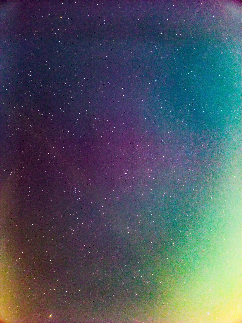Colorful starry night sky with scattered bright stars on dark background