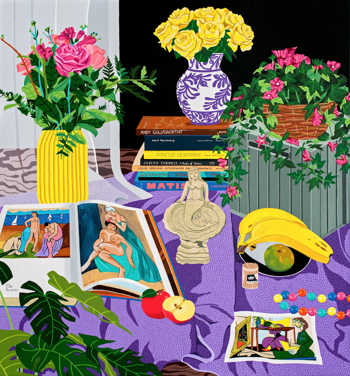 Vibrant still life with flowers, books, and mermaid statue on purple fabric
