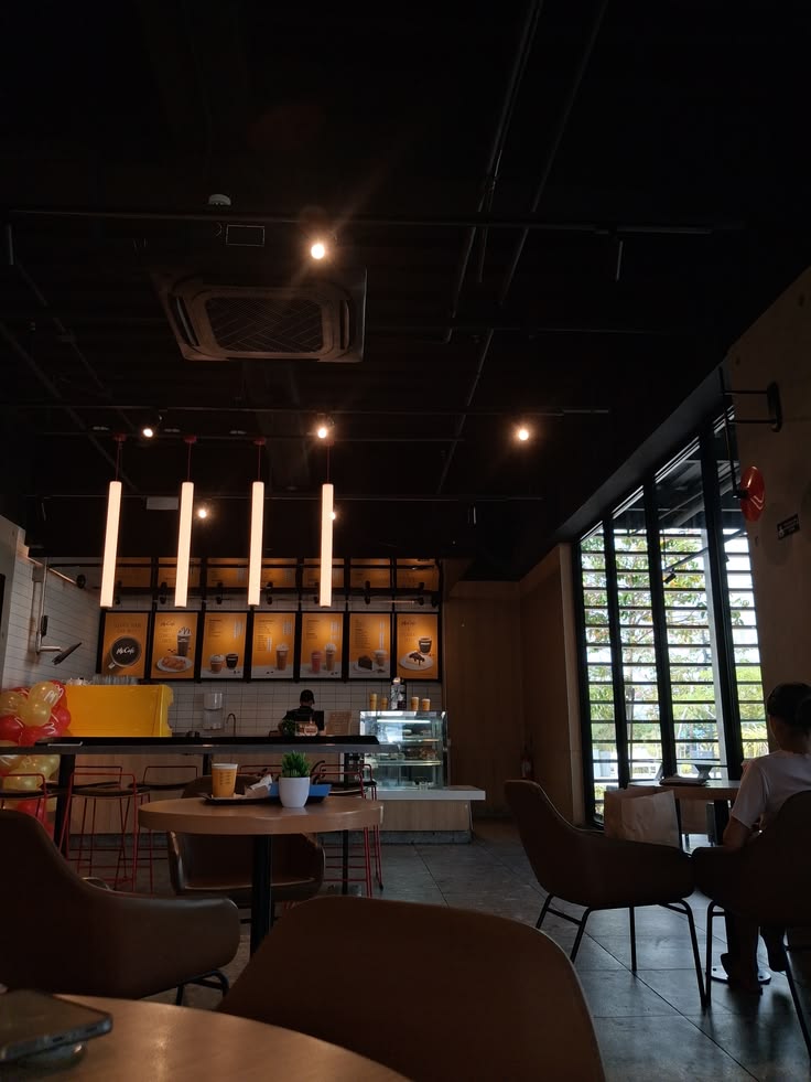 Cozy cafe interior with coffee cups and pastries on a wooden table