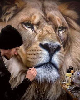 Artist painting a highly realistic lion portrait with intricate detail