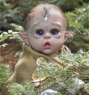 Baby elf with oversized eyes and pointed ears surrounded by ferns