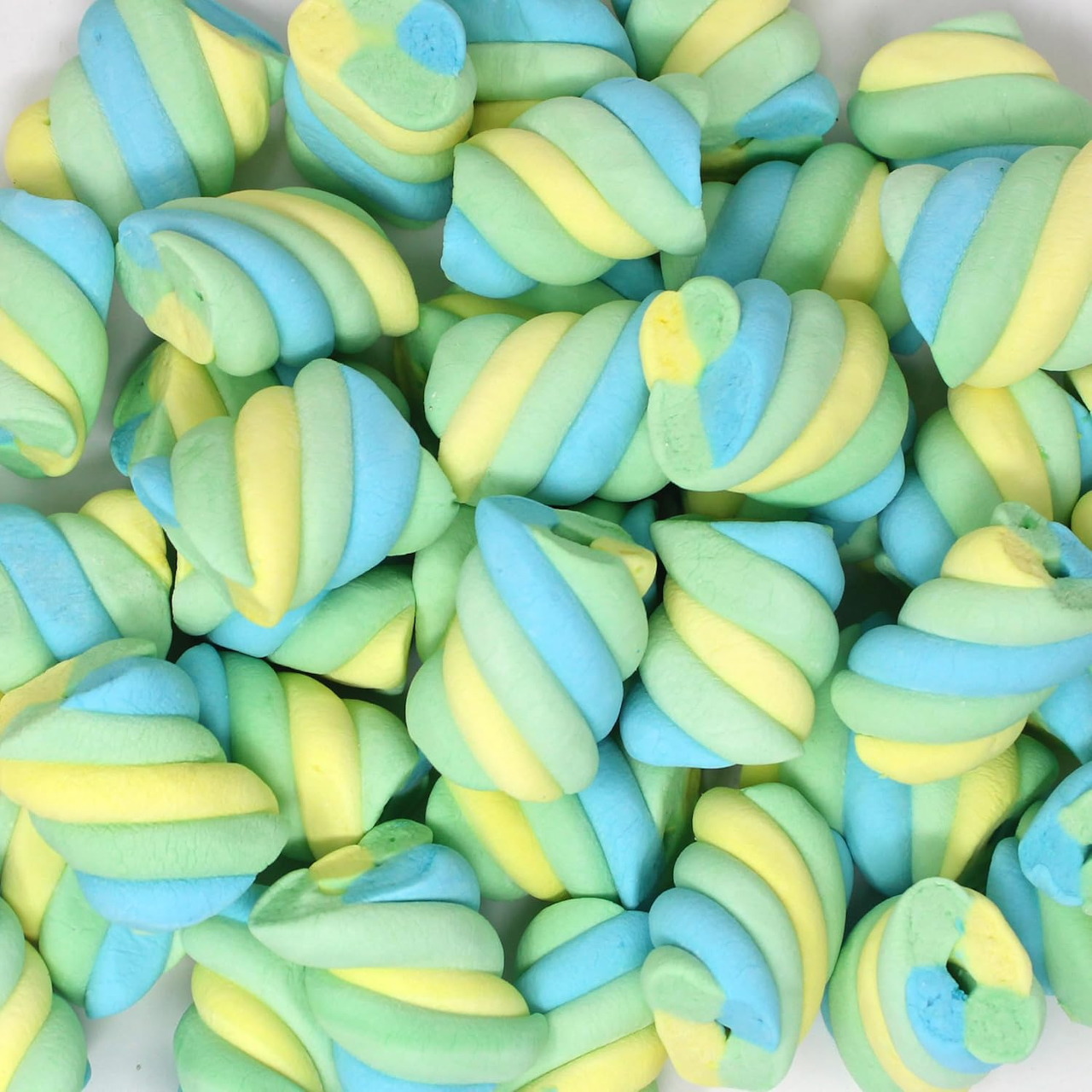 Pile of pastel blue, yellow, and green twisted marshmallow candies