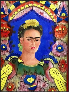 Painted portrait of Frida Kahlo with flower crown, birds, and colorful folk art decorations