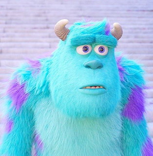 Close-up portrait of Sulley, a blue furry monster with purple spots and small horns