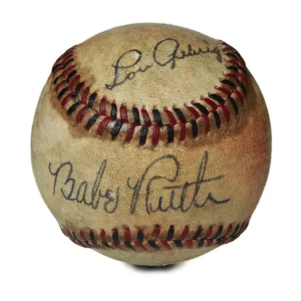 Aged baseball with Babe Ruth and Lou Gehrig signatures and red stitching