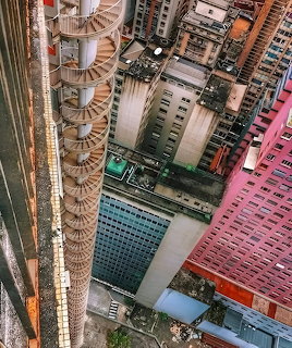Aerial view of São Paulo high-rise buildings with a spiral stair tower and pink building