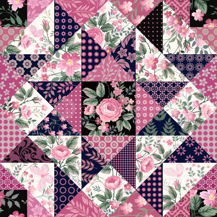 Patchwork quilt with pink floral and navy geometric fabric patches in triangular pattern