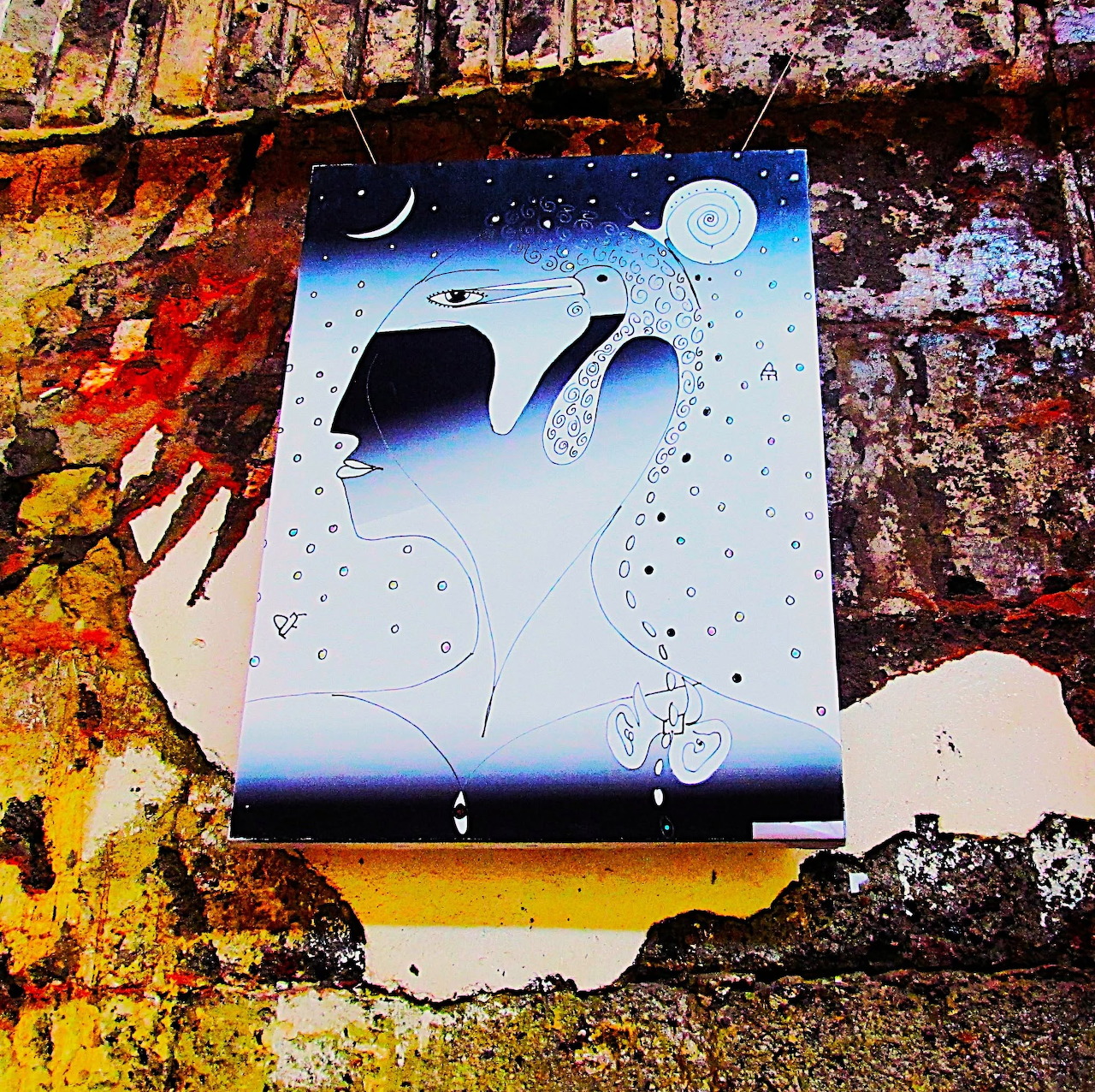 Abstract canvas with blue shapes, circles, and moon on textured painted surface with autumn colors