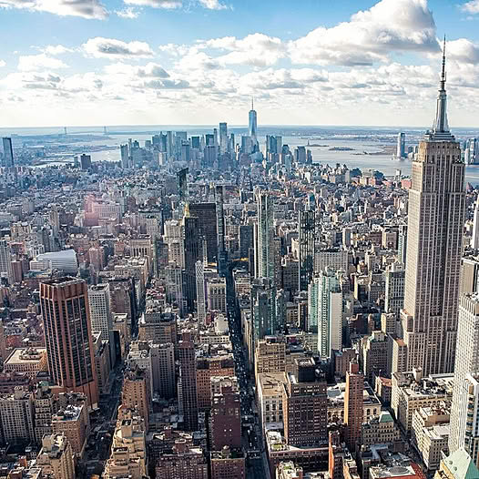 Aerial photograph of Manhattan skyline with Empire State Building and dense cityscape