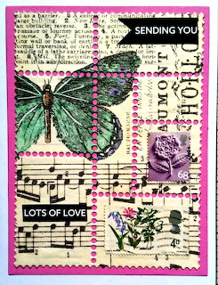Greeting card collage with teal butterfly on vintage music sheet and postage stamps background