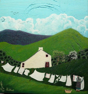 Folk art painting of a white cottage on green hillside with laundry lines and mountains behind
