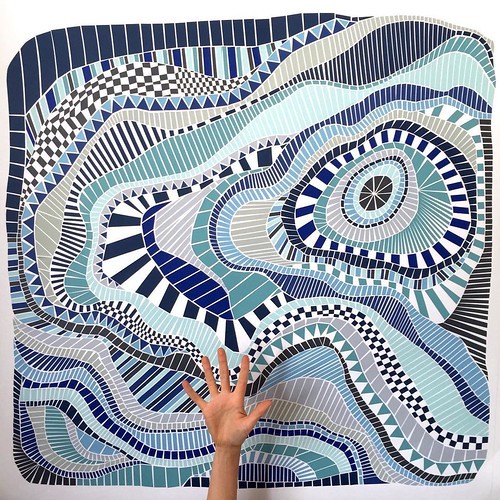 Abstract artwork with swirling blue and white striped patterns, spirals, and geometric line designs