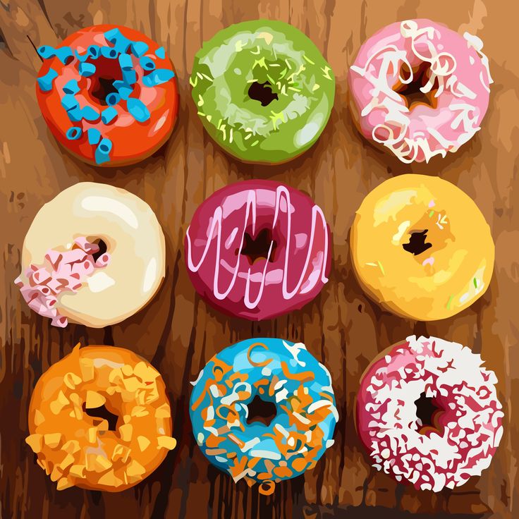 Nine colorful frosted donuts with various toppings arranged in three rows on wood background
