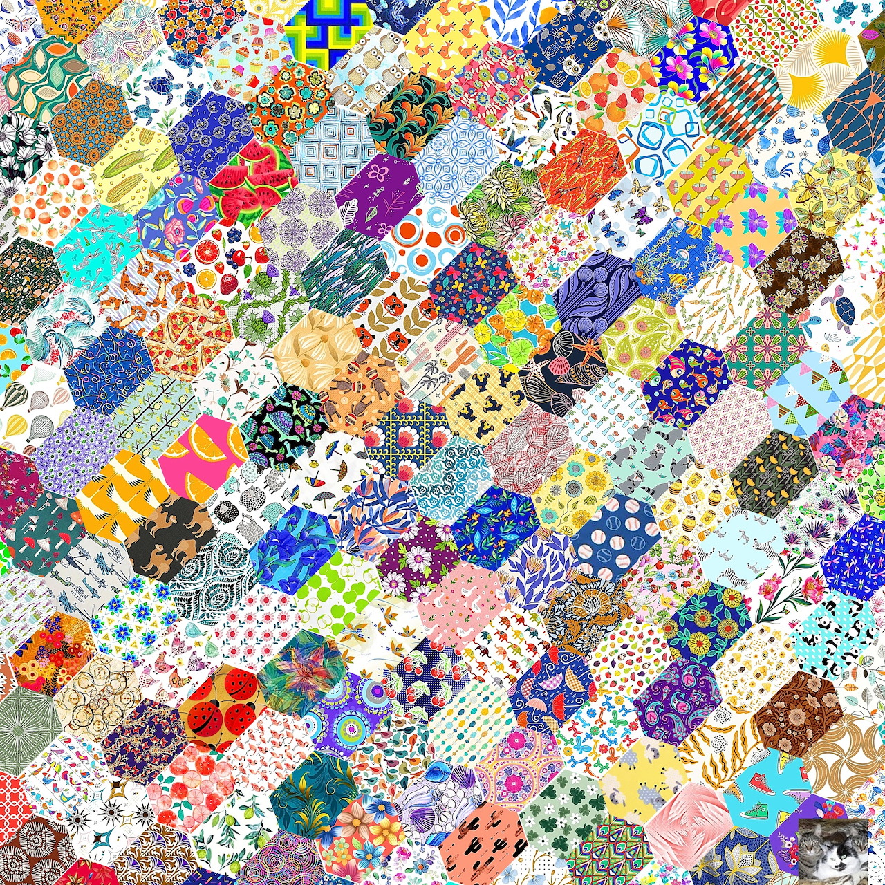 Colorful hexagonal patchwork quilt with varied floral and geometric fabric patterns