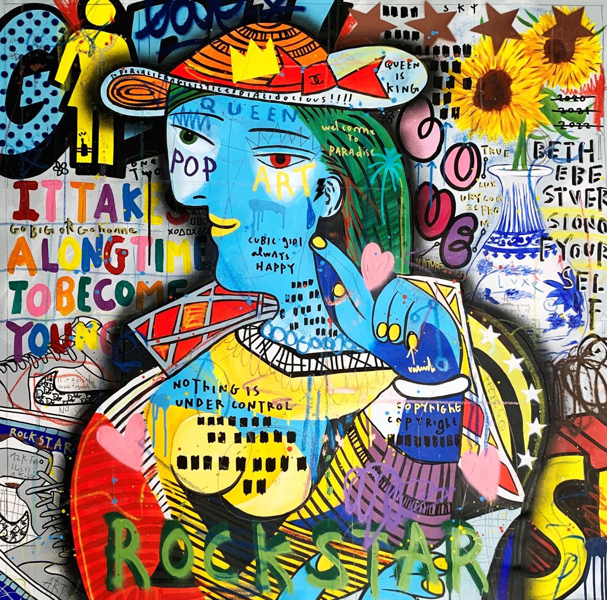 Abstract collage artwork with blue-faced figure, graffiti text, sunflowers, and colorful mixed-media elements