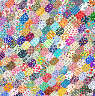 Colorful patchwork quilt with diverse fabric patterns including florals, dots, and geometric designs