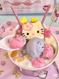 Hello Kitty dessert plate with kawaii treats and colorful mochi on pink Sanrio background