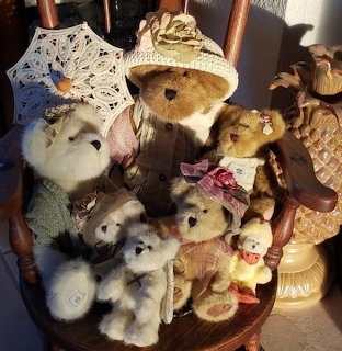 Teddy bear seated on an old wooden chair