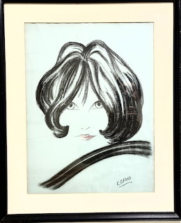 Framed charcoal drawing of a woman with large dark hair covering most of her face, signed C. Sfara