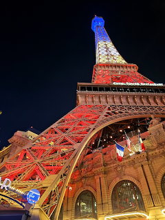 Illuminated Eiffel Tower replica above the Paris Las Vegas building at night